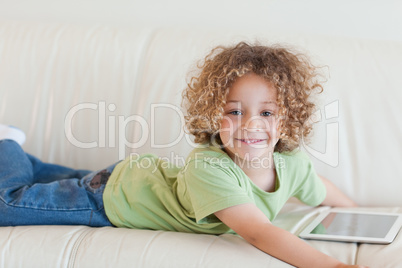 Smiling boy using a tablet computer