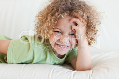 Boy lying on a sofa