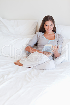 Portrait of a woman holding a book