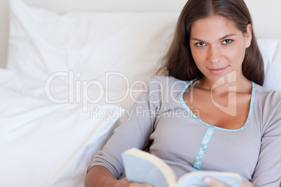 Attractive woman holding a book