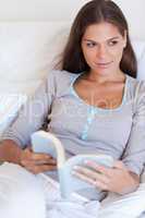 Portrait of a beautiful woman holding a book