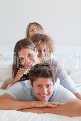 Portrait of a family lying on each other