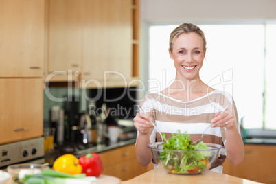 Woman preparing healthy salad