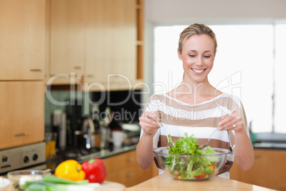 Smiling woman preparing meal