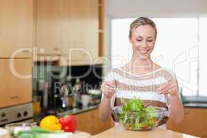 Smiling woman preparing meal
