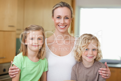Mother with daughter and son in the kitchen