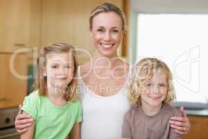Mother with daughter and son in the kitchen