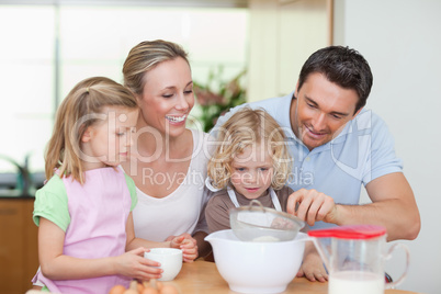 Family preparing dough