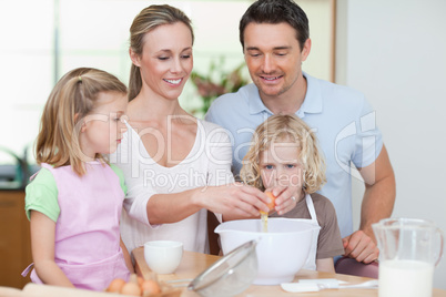 Family preparing dough together