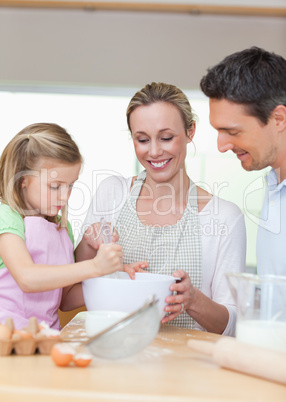 Family preparing cookies together