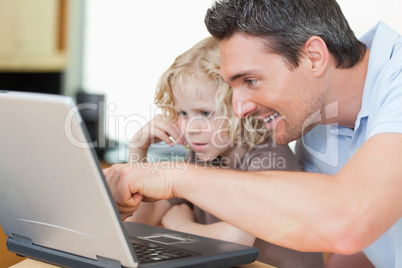 Father showing his son the internet
