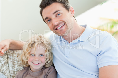 Father and son on couch