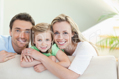 Parents with daughter on the couch