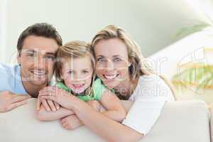 Parents with daughter on the couch