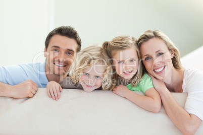 Smiling family on the couch