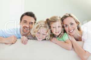 Smiling family on the couch