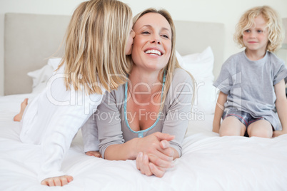 Daughter giving her mother a kiss