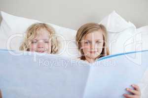 Brother and sister reading bedtime story