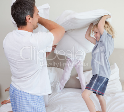 Family having a pillow fight