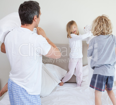 Playful family having a pillow fight