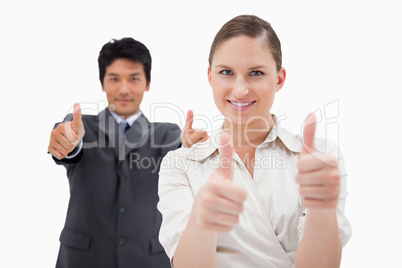 Business people with the thumbs up