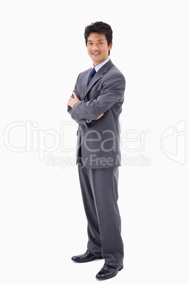 Portrait of a smiling businessman with the arms crossed