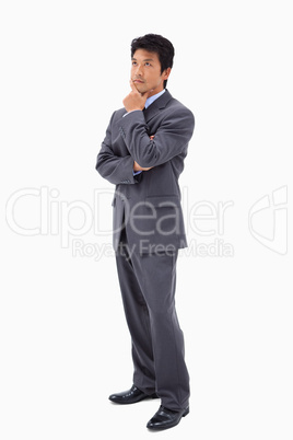 Portrait of a thoughtful businessman with the arms crossed