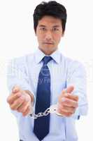 Portrait of a businessman with handcuffs