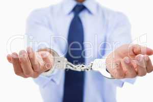 Close up of a professional's hands with handcuffs