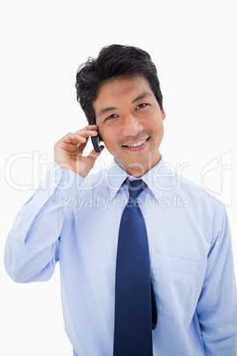 Portrait of a smiling businessman making a phone call