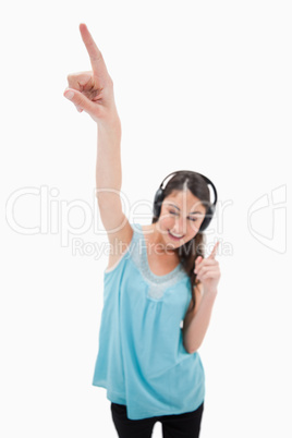 Portrait of a woman dancing while listening to music