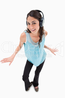 Portrait of a cheerful woman dancing while listening to music