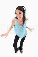 Portrait of a cheerful woman dancing while listening to music