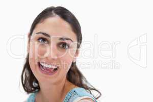 Close up of a cheerful woman smiling at the camera