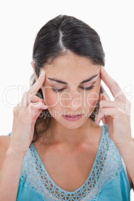 Portrait of a young woman having a headache