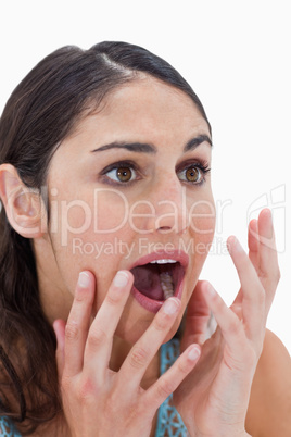 Portrait of a shocked young woman gesturing