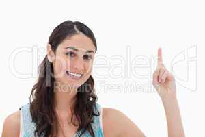 Woman pointing at a copy space