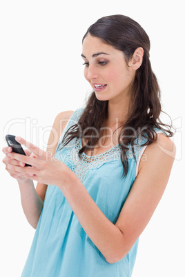 Portrait of a woman reading a text message