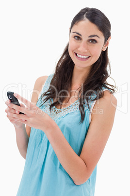 Portrait of a happy woman reading a text message