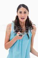 Portrait of a shocked woman reading a text message