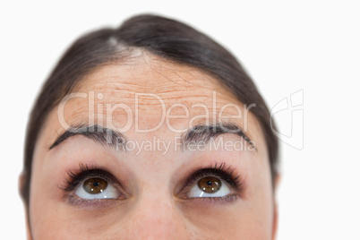 Close up of a woman looking above her