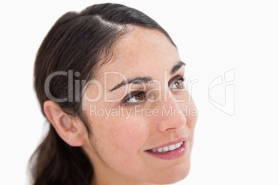 Close up of a young woman looking away from the camera