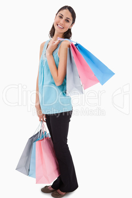 Portrait of a woman posing with shopping bags