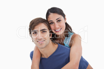 Man holding his girlfriend on his back