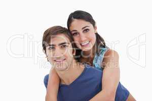 Man holding his girlfriend on his back