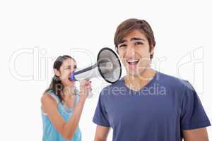 Woman yelling at her boyfriend through a megaphone
