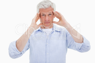 Mature man having a headache