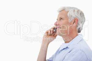 Side view of a mature man making a phone call