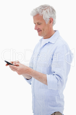 Portrait of a man using his mobile phone