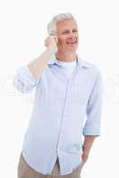 Portrait of a happy mature man using his mobile phone